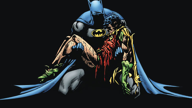 Batman holds the corpse of Jason Todd