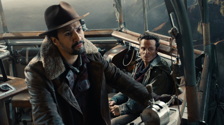 Lin-Manuel Miranda and Andrew Scott as Lee Scoresby and John Parry on a flying ship in His Dark Materials