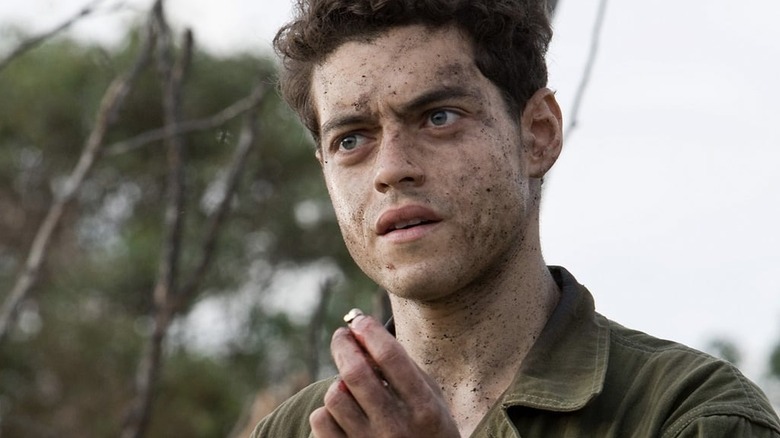 Rami Malek as Snafu covered in dirt in The Pacific