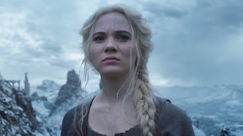 Freya Allan as Ciri standing on a snowy mountain in The Witcher