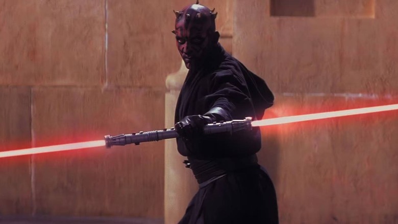 Darth Maul (Ray Park) with a dual-edged red lightsaber in Star Wars: Episode I - The Phantom Menace