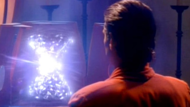 Kira Nerys (Nana Visitor) looks at a shimmering Prophet in Star Trek: Deep Space Nine