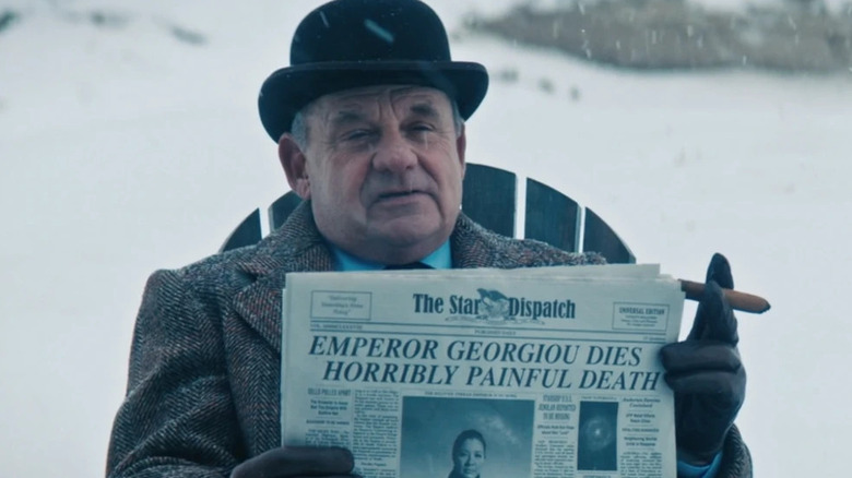 Carl (Paul Guilfoyle) holds up a newspaper while seated and smoking a cigar in Star Trek: Discovery