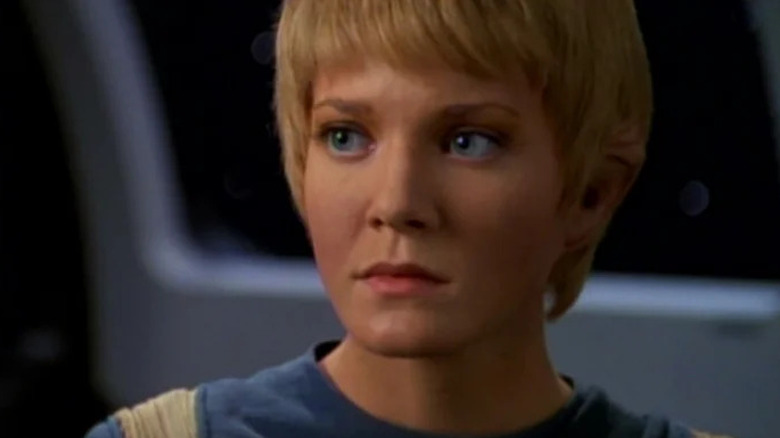 Kes (Jennifer Lien) looks apprehensive by a window in Star Trek: Voyager