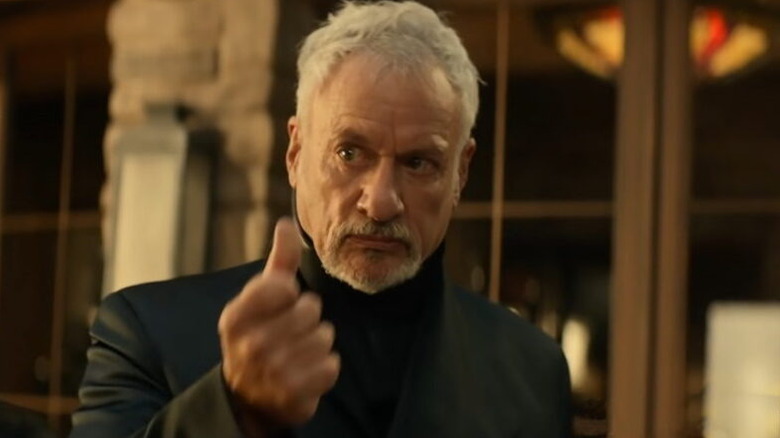 An older Q (John de Lancie) snaps his fingers in Star Trek: Picard