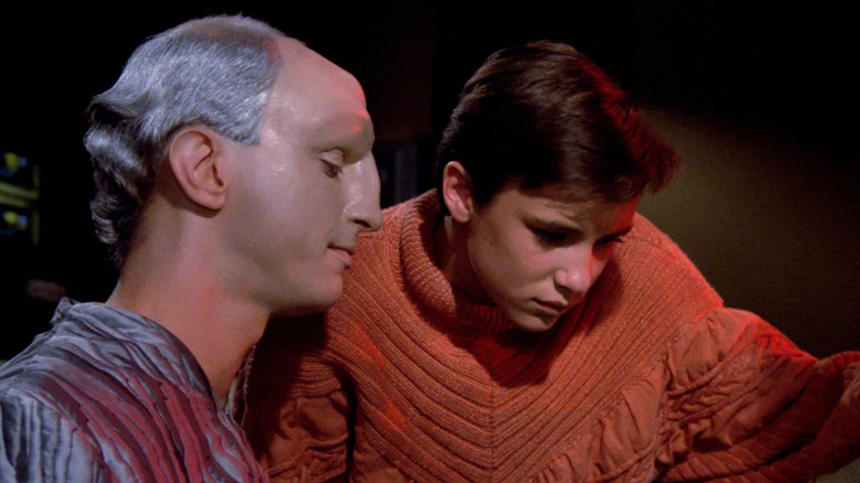 The Traveler (Eric Menyuk) and Wesley Crusher (Wil Wheaton) examine a console together in Star Trek: The Next Generation