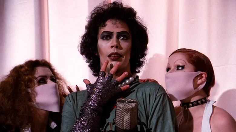 Patricia Quinn, Tim Curry, and Little Nell as Magenta, Dr. Frank-N-Furter, and Columbia in The Rocky Horror Picture Show