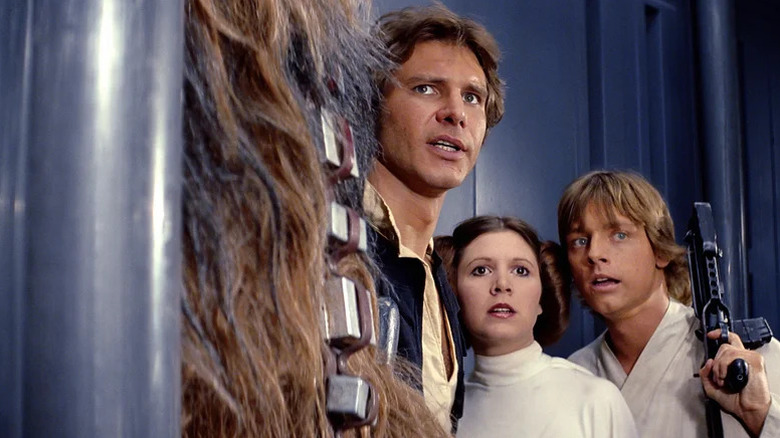 Harrison Ford, Carrie Fisher, and Mark Hamill as Han Solo, Princess Leia, and Luke Skywalker in Star Wars: A New Hope
