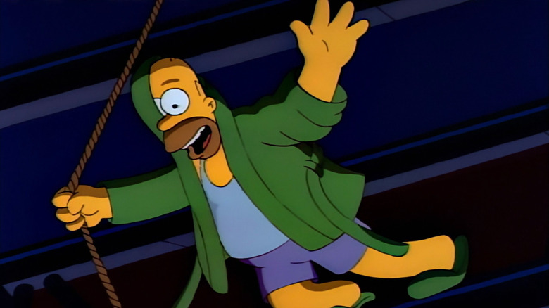 Homer Simpson dangling from the rafters on The Simpsons