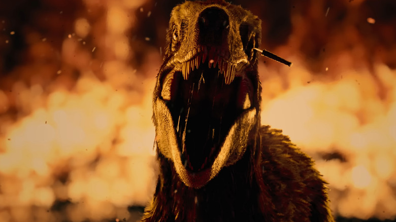 A raptor roaring with a knife in its eye in Primitive War