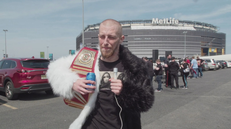 Wrestling fan being interviewed in How To With John Wilson