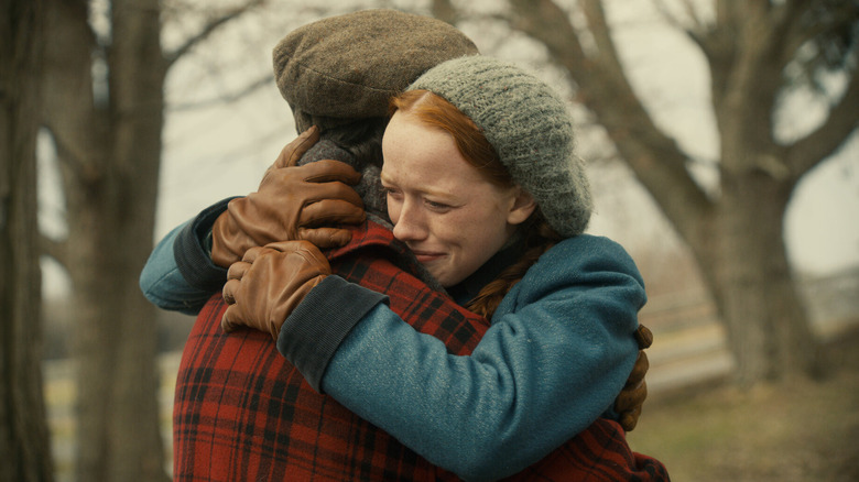 Anne (Amybeth McNulty) hugging a boy in the woods in Anne With an E
