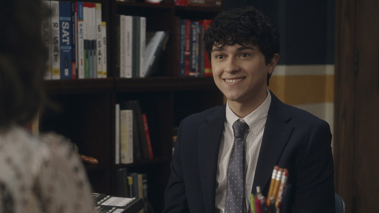 Rafa (Ignacio Diaz-Silverio) sits excitedly in a counselor's office in Primo