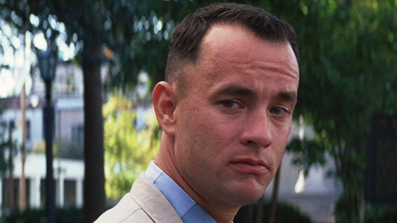 Tom Hanks as Forrest Gump, sitting on a bench in Forrest Gump.