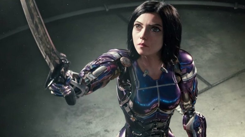 Rosa Salazar as Alita holds up a sword in Alita: Battle Angel