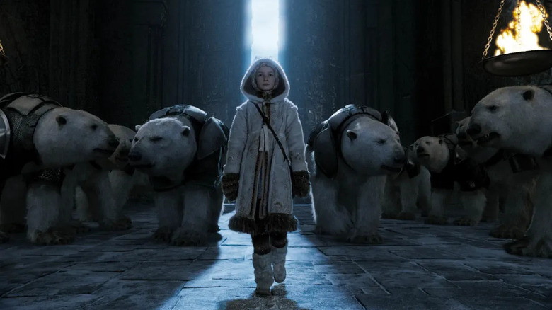 Dakota Blue Richards as Lyra Belacqua walks amongst polar bears in The Golden Compass