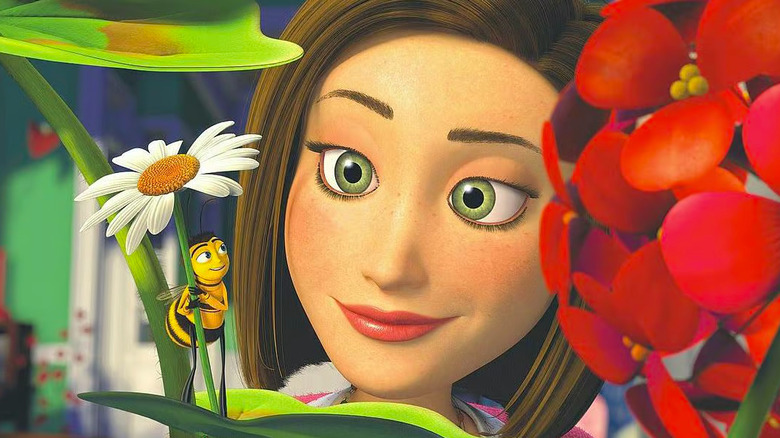 Animated woman with brown hair and green eyes smiling at bee standing on leaf holding flower in Bee Movie