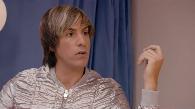 Sacha Baron Cohen with blonde hair and shiny silver jacket as Bruno in Bruno