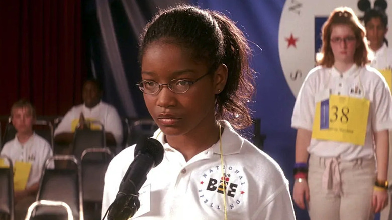 Young Keke Palmer as Akeelah stands at a microphone in a spelling bee in Akeelah and the Bee