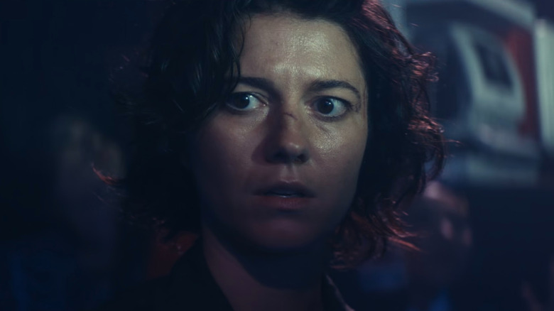 Kate (Mary Elizabeth Winstead) looking startled in a club in Kate