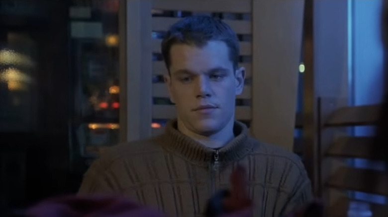 Jason Bourne (Matt Damon) illuminated by blue light in The Bourne Identity