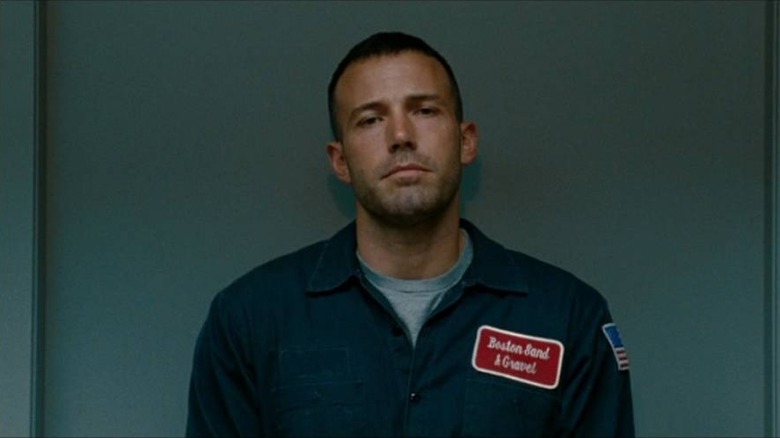 Doug MacRay (Ben Affleck) leaning against a door in The Town