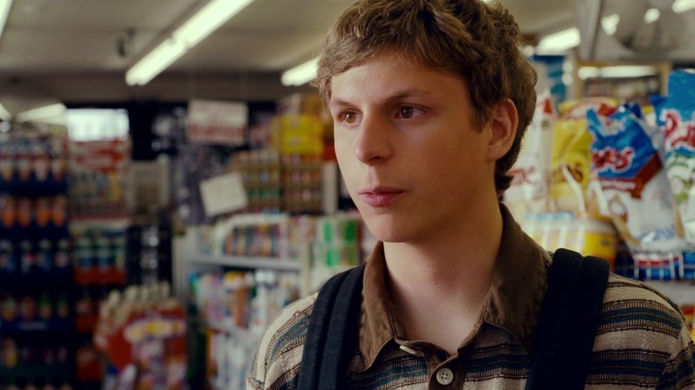 Michael Cera as Evan standing in a convenience store in Superbad
