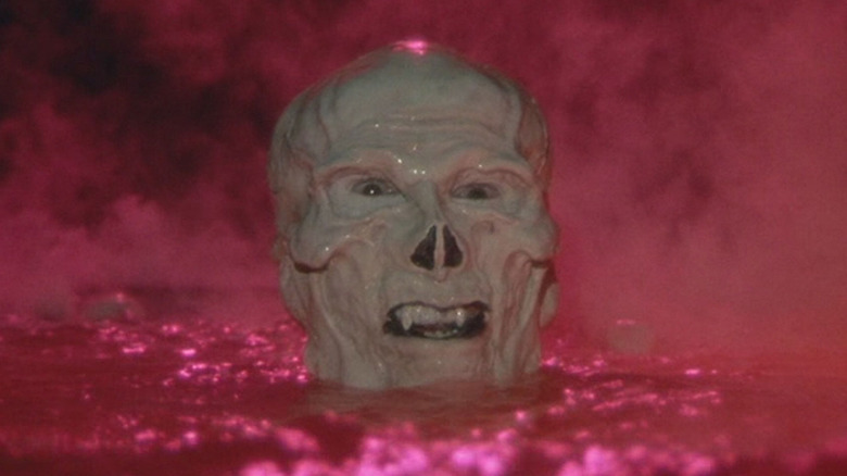 Frank Langella as Skeletor lingers in a pool of water in Masters of the Universe