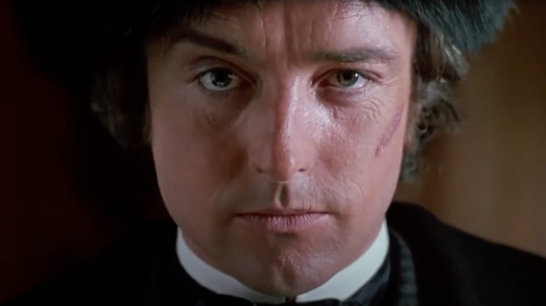 Anthony Higgins as Rathe stares into the camera in Young Sherlock Holmes