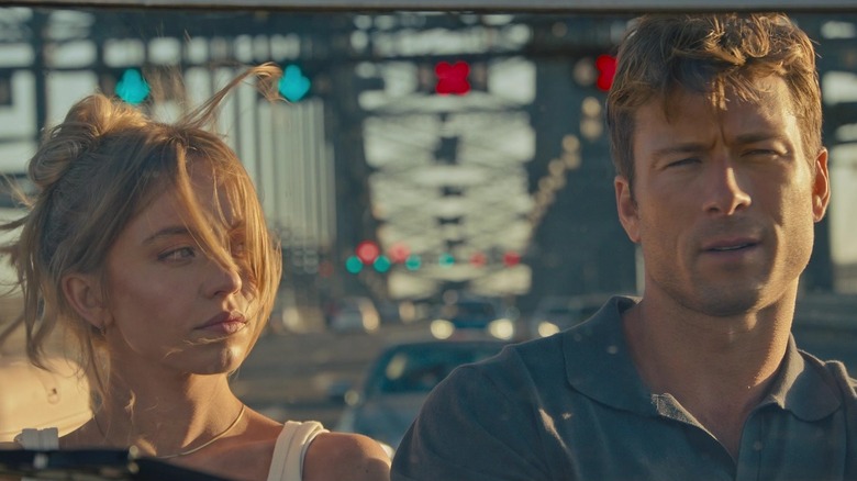 Bea (Sydney Sweeney) and Ben (Glen Powell) driving in Anyone But You