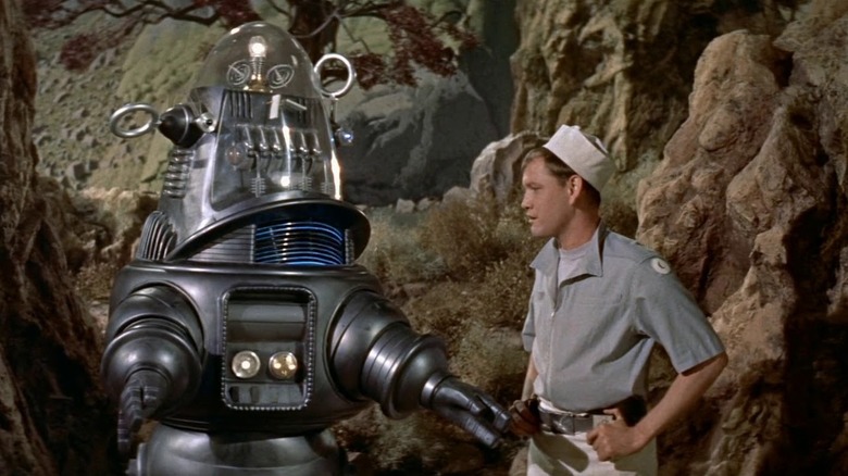 Robby The Robot talks to Cook (Earl Holliman) in Forbidden Planet