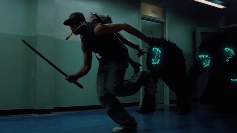 Moses (John Boyega) running away from aliens in Attack the Block