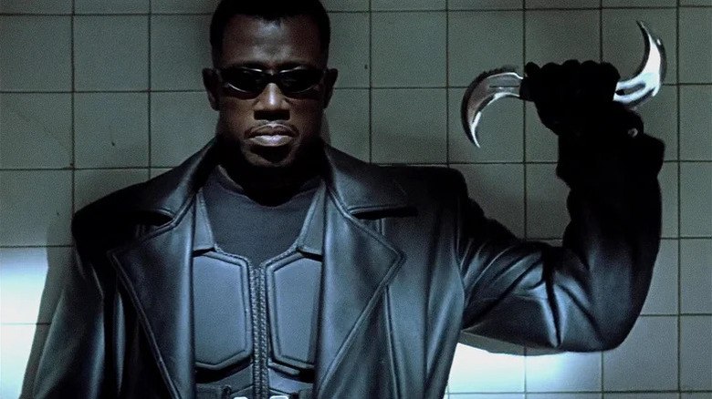 Blade (Wesley Snipes) holding a bladed weapon in Blade