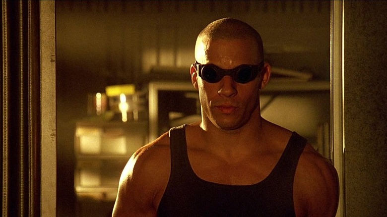 Riddick (Vin Diesel) wearing black goggles in Pitch Black