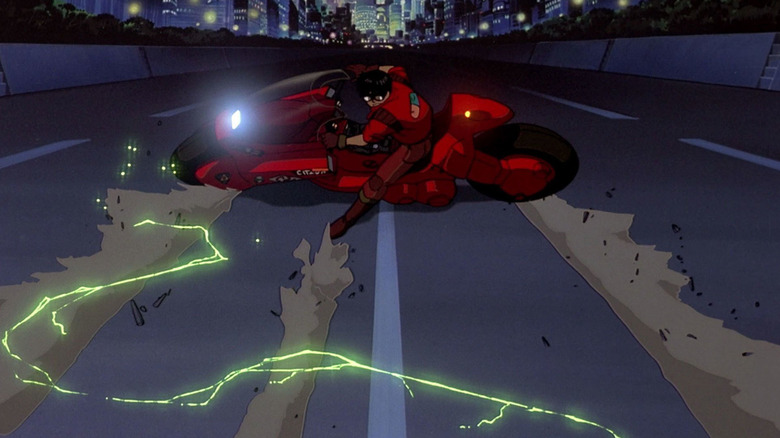 Kaneda (Mitsuo Iwata) slides on his motorcycle in Akira
