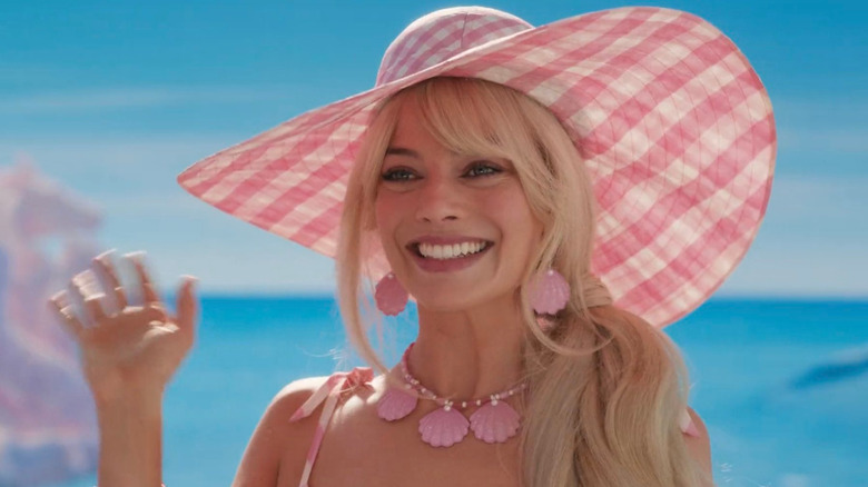 Barbie (Margot Robbie) waves hello in Barbie