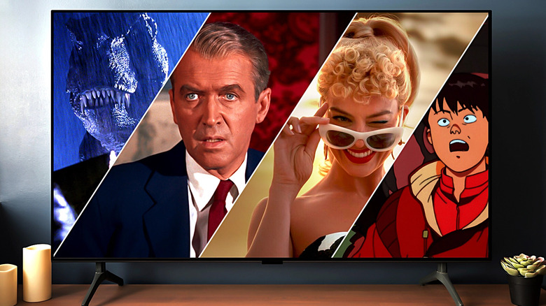 A T-Rex from Jurassic Park, Scottie (James Stewart) from Vertigo, Barbie (Margot Robbie) from Barbie, and Kaneda (Mitsuo Iwata) from Akira, all on an OLED TV
