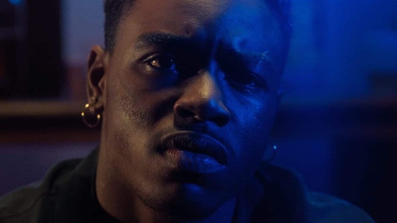 Caine (Tyrin Turner) sits with sadness in Menace II Society