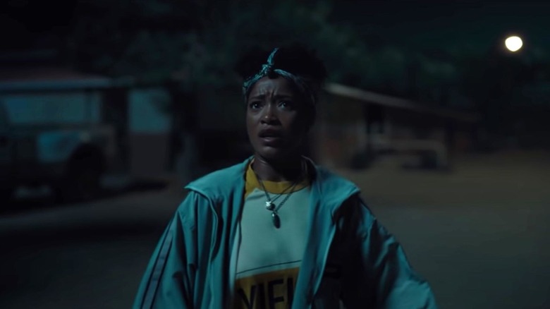 Em (Keke Palmer) looks up in terror in Nope