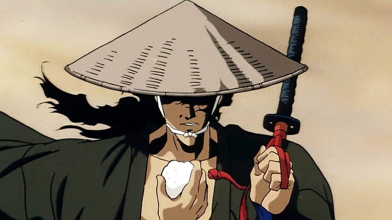 A man holds up his katana in Ninja Scroll
