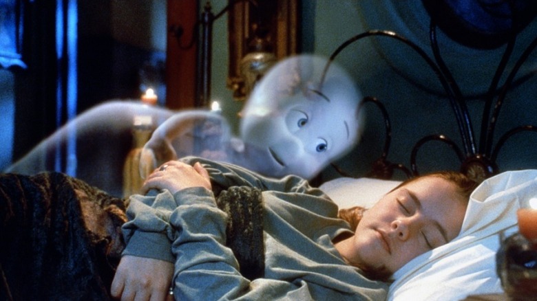 Malachi Pearson as Casper lies next to Christina Ricci as Kat in Casper