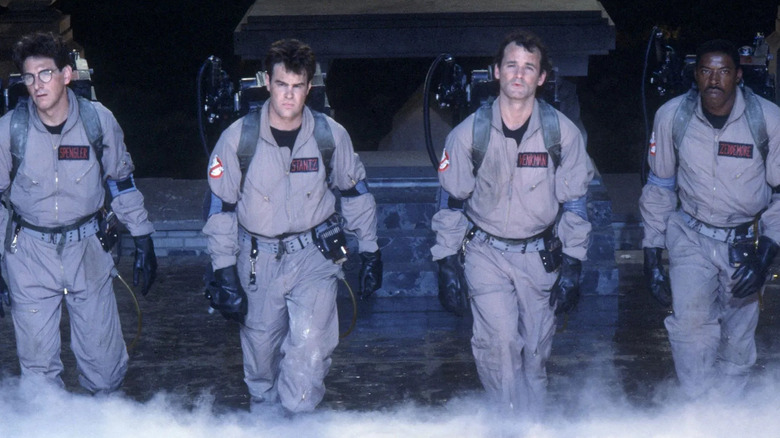 Harold Ramis as Egon Spengler, Dan Aykroyd as Ray Stanz, Bill Murray as Peter Venkman and Ernie Hudson as Winston Zeddemore stand side-by-side in Ghostbusters