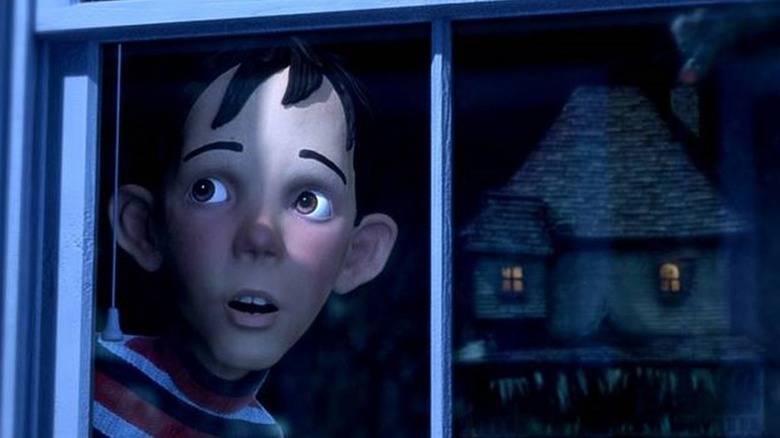 Mitchel Musso as DJ stares out his window at a creepy house in Monster House