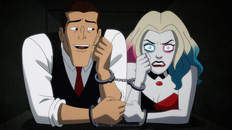 A cured joker and Harley Quinn handcuffed together in a vent in Harley Quinn
