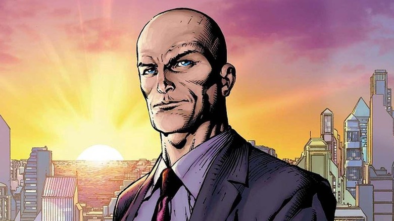 Lex Luthor stands in front of the Metropolis skyline as the sun sets