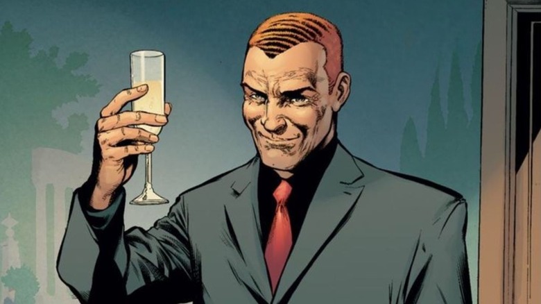 Norman Osborn raises a glass of champagne