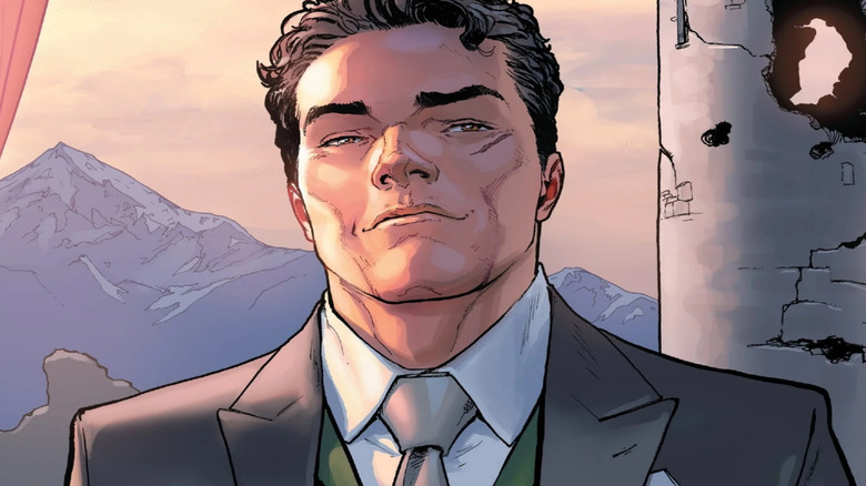 Victor von Doom, wearing a suit and standing in front of a castle