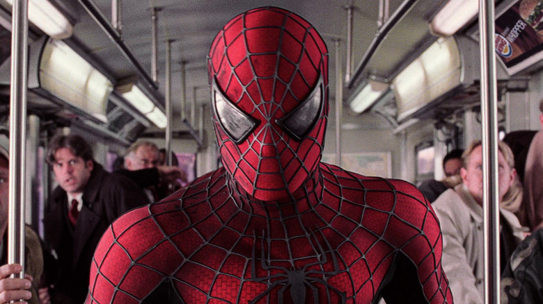 Spider-Man standing inside a train car in Spider-Man 2