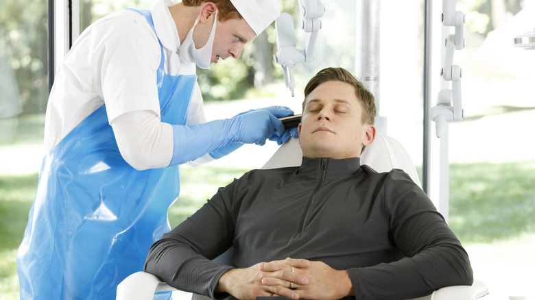 The main character relaxes for a medical treatment