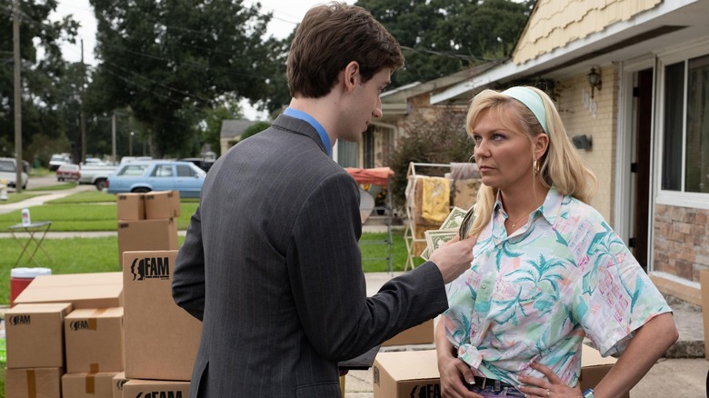 Kirsten Dunst stands her ground, surrounded by merchandise